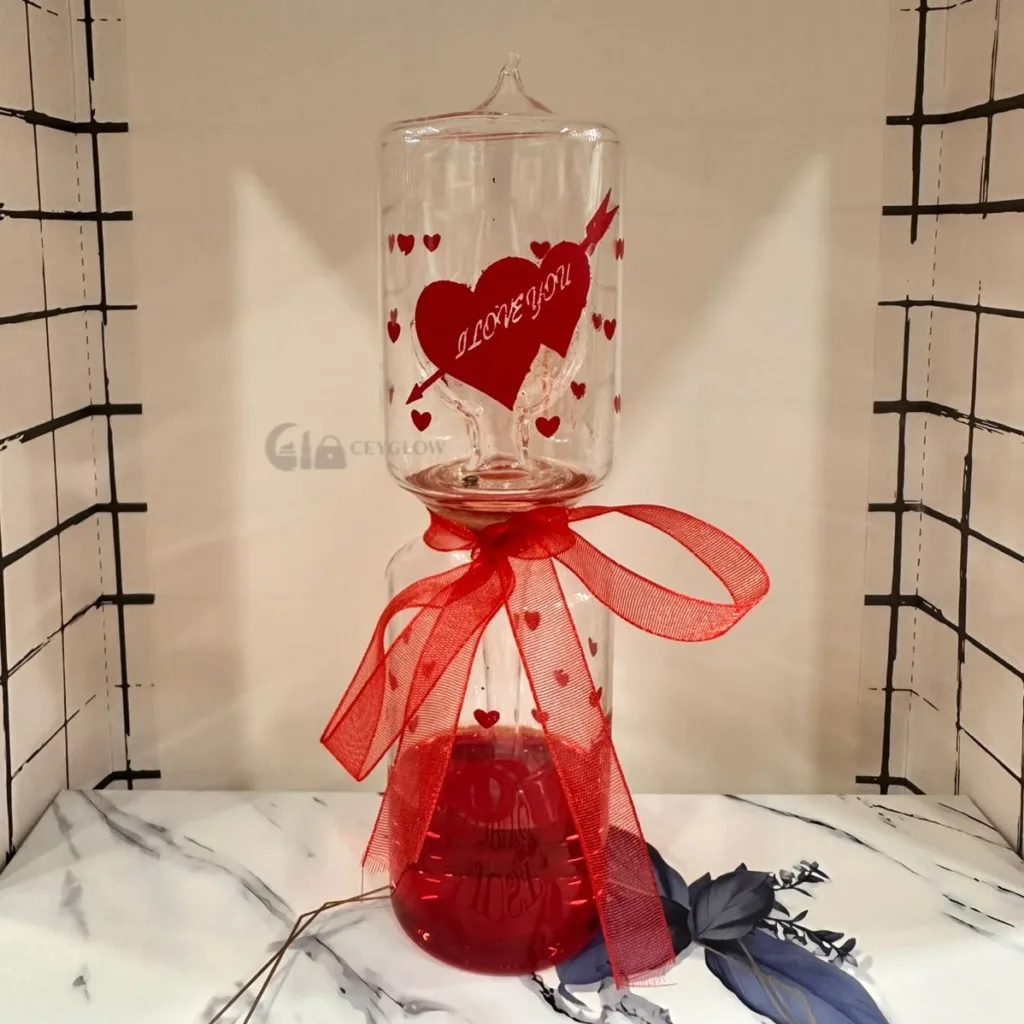 Romantic heartbeat glass with red liquid and heart design