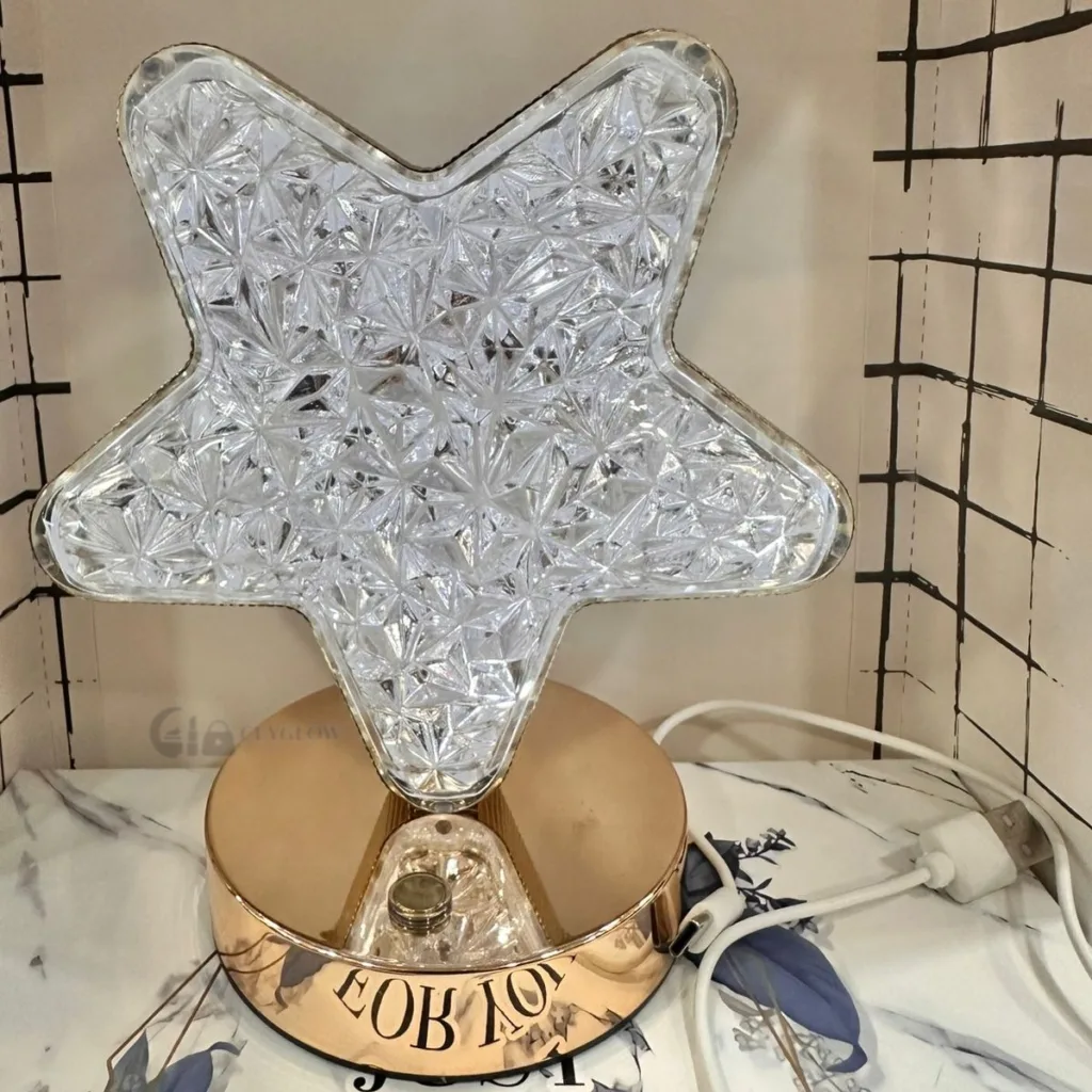 Star shaped crystal LED lamp with gold base and warm light
