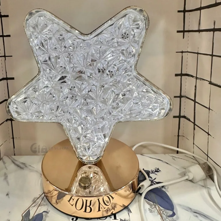 Star shaped crystal LED lamp with gold base and warm light