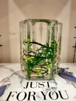 Decorative glass pen holder with nature-inspired liquid art design green