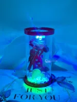 Romantic couple silhouette inside transparent bottle with LED lights