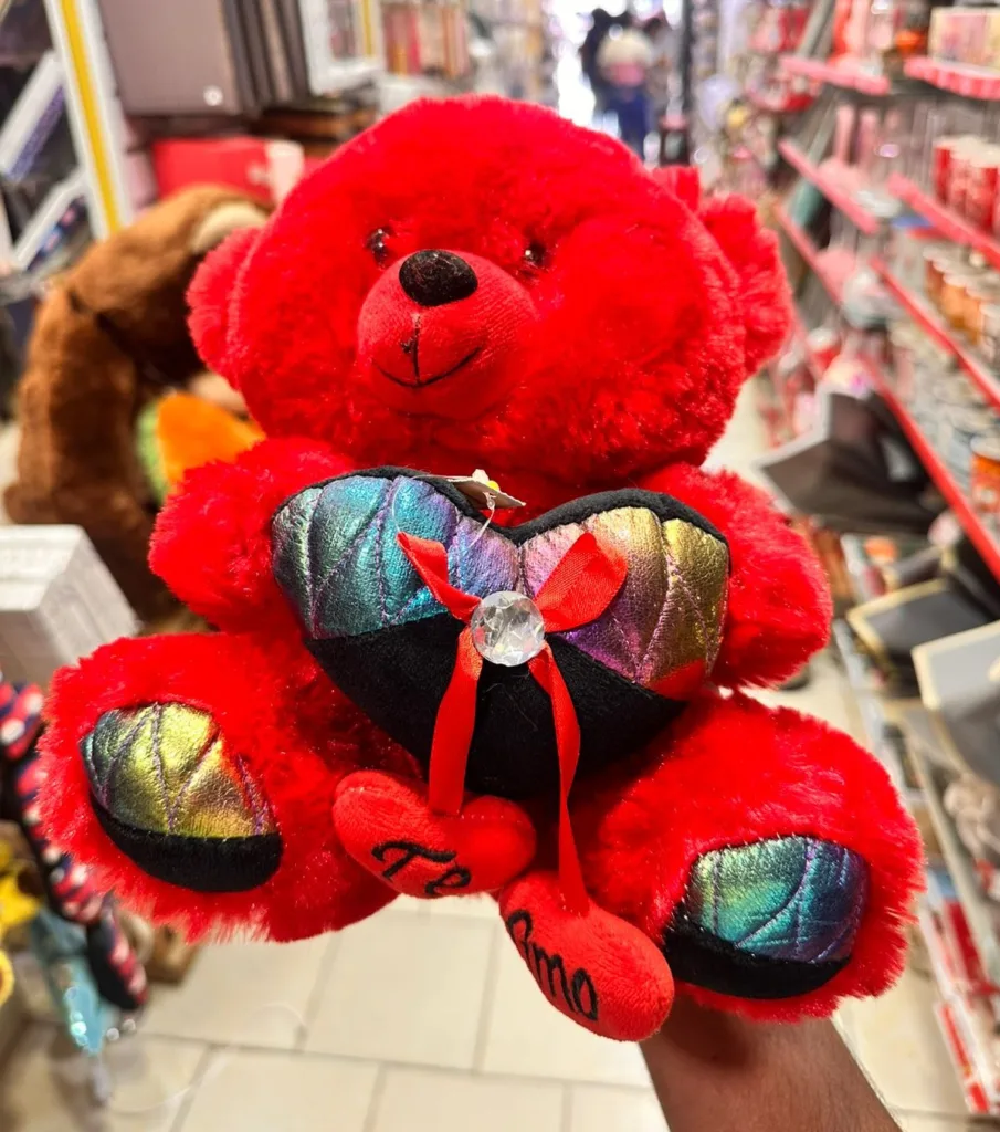 Red soft teddy bear with decorative heart romantic gift