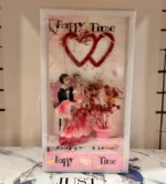 Romantic couple figurine inside LED display box with heart decor